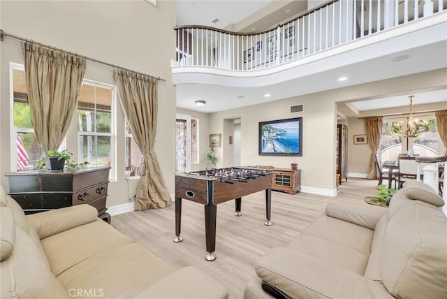 2 Aquila Way, Coto De Caza, CA 92679 - playroom with baseboards, a high ceiling, light wood-type flooring, a chandelier, and recessed lighting