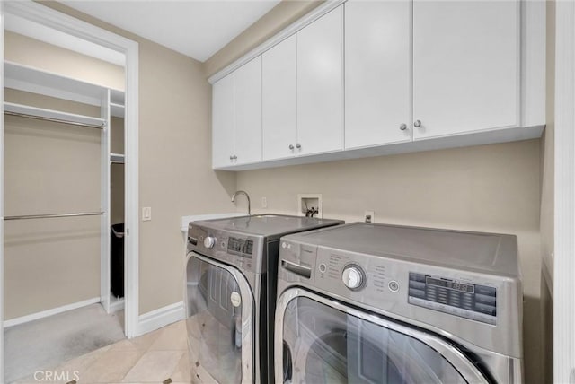 2 Aquila Way, Coto De Caza, CA 92679 - laundry area with cabinet space, washer and dryer, and baseboards