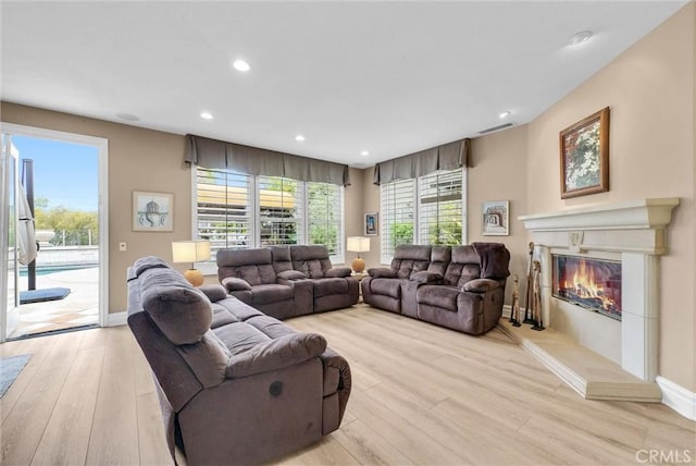 2 Aquila Way, Coto De Caza, CA 92679 - living room with light wood-style floors, a glass covered fireplace, baseboards, and recessed lighting