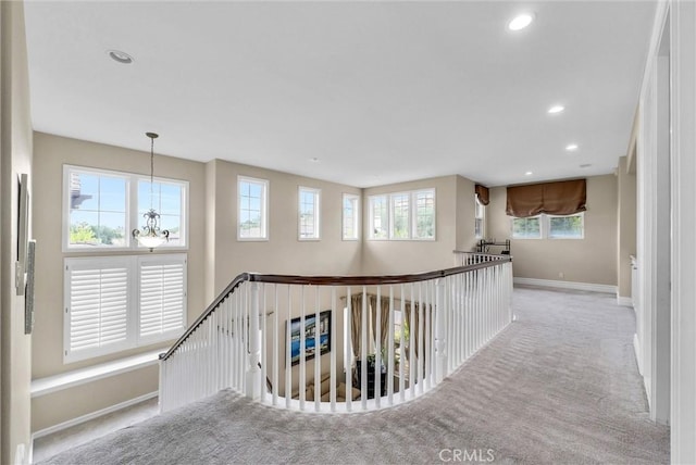 2 Aquila Way, Coto De Caza, CA 92679 - corridor with carpet floors, an upstairs landing, baseboards, a chandelier, and recessed lighting