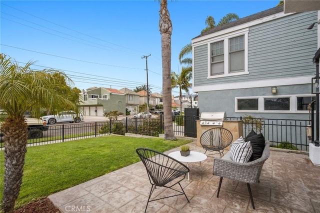 view of patio featuring grilling area, fence, a residential view, and area for grilling