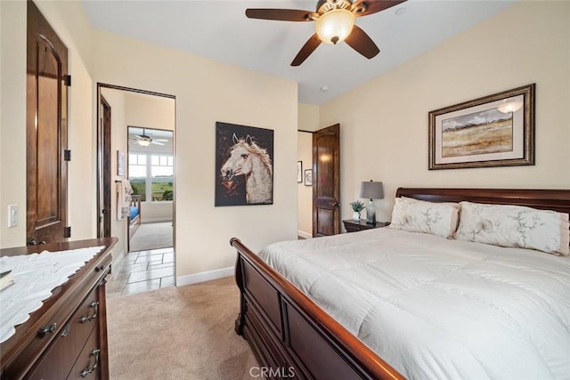 bedroom with light carpet, baseboards, and ceiling fan