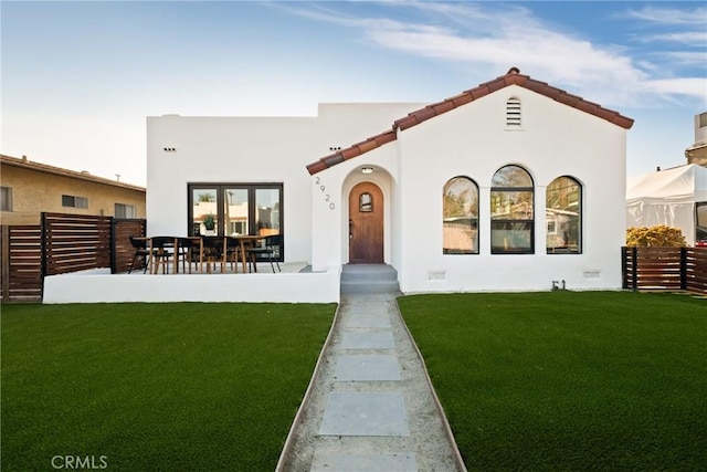 2920 Bancroft St, San Diego, CA 92104 - back of house with a patio, stucco siding, fence, and a lawn