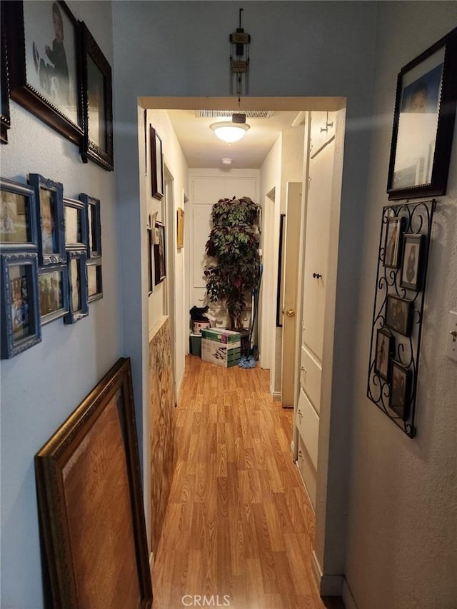 hall with light wood-style flooring