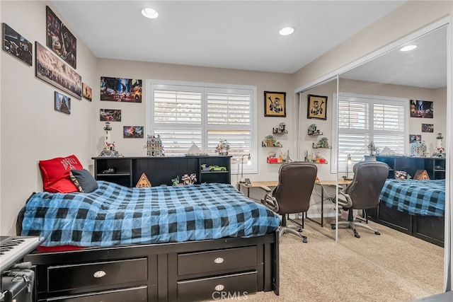 carpeted bedroom featuring recessed lighting
