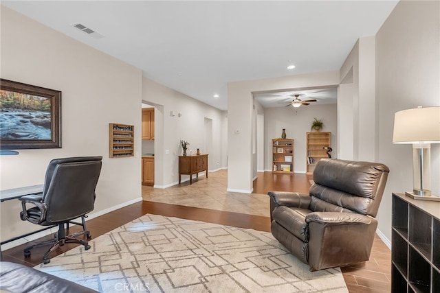 living area with visible vents, baseboards, ceiling fan, recessed lighting, and wood finished floors