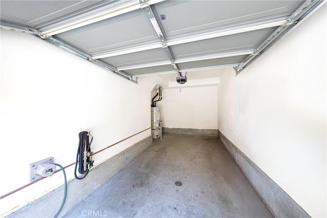 garage featuring a garage door opener and secured water heater
