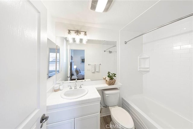 full bath featuring shower / bathtub combination, vanity, connected bathroom, and toilet