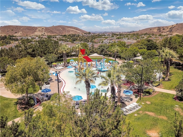birds eye view of property featuring a mountain view