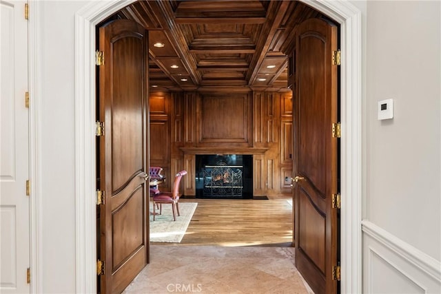 hallway featuring recessed lighting, coffered ceiling, wood walls, ornamental molding, and beam ceiling