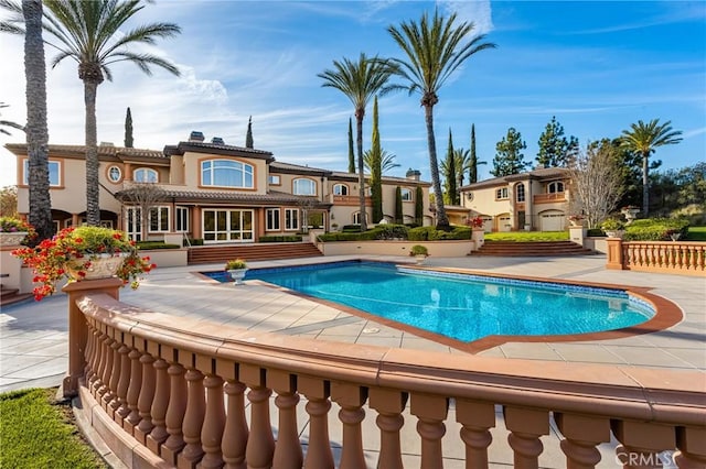 outdoor pool featuring a patio area