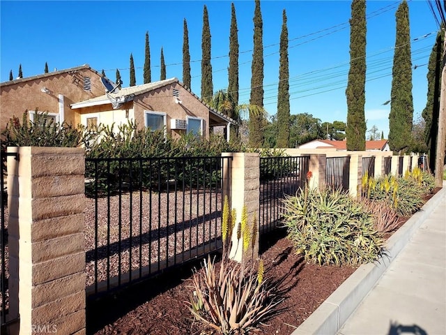 view of gate with fence