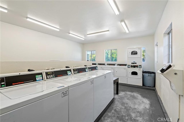 community laundry room featuring stacked washer / dryer and independent washer and dryer