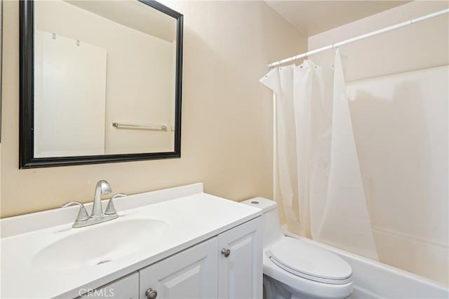 bathroom featuring toilet and vanity