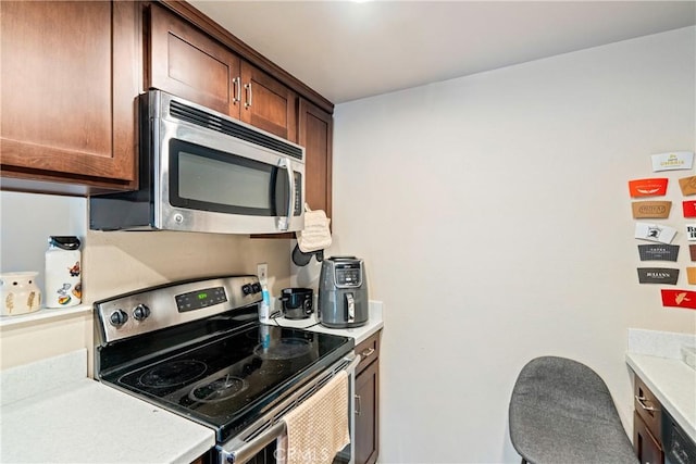 kitchen with light countertops and stainless steel appliances