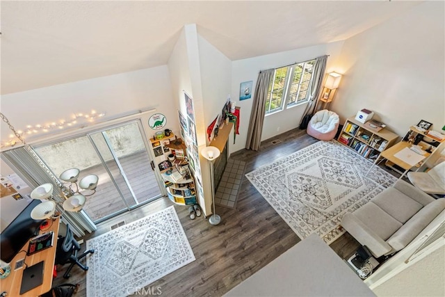 interior space with wood finished floors and visible vents