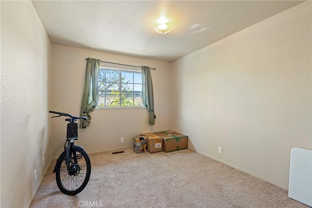 interior space featuring carpet, visible vents, and baseboards