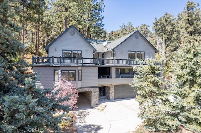 2405 Cedarwood Dr, Pine Mountain Club, CA 93222 - view of front facade featuring a balcony and an attached garage