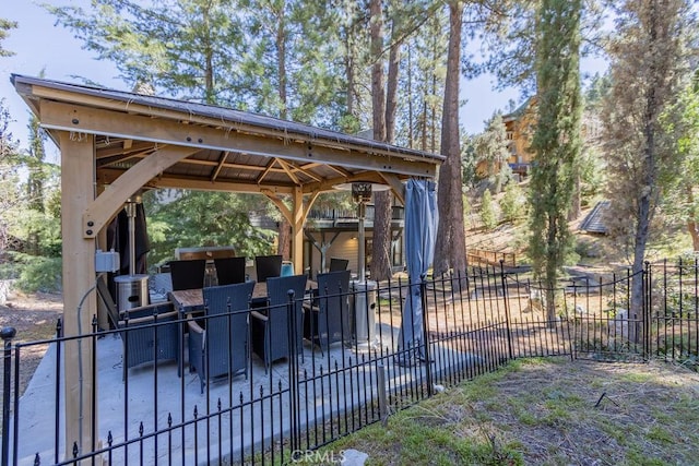 view of property's community featuring a gazebo and fence