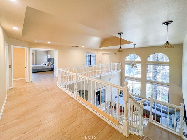 2405 Cedarwood Dr, Pine Mountain Club, CA 93222 - hall with an upstairs landing, wood finished floors, baseboards, plenty of natural light, and recessed lighting