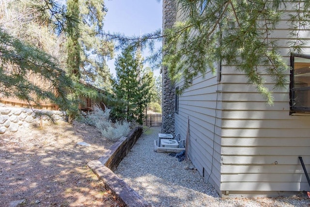 view of property exterior with fence
