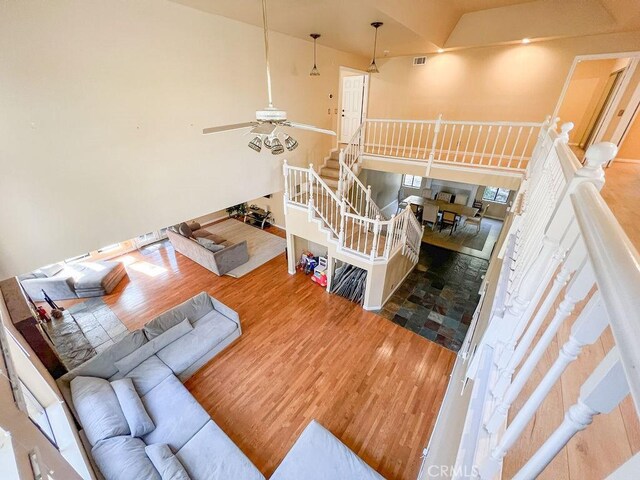 2405 Cedarwood Dr, Pine Mountain Club, CA 93222 - living room featuring a ceiling fan, wood finished floors, and stairway