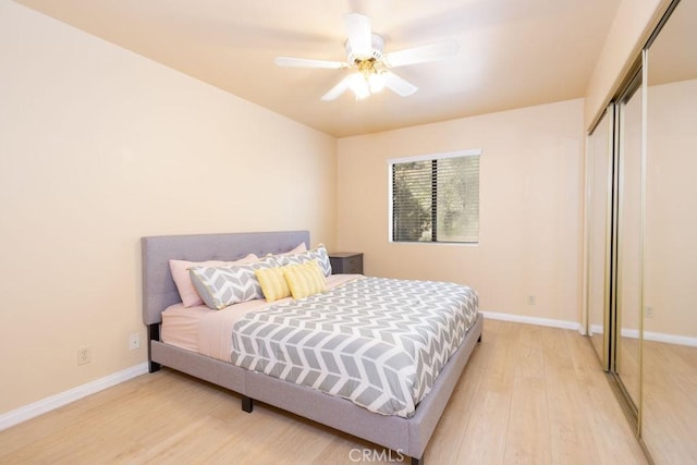 2405 Cedarwood Dr, Pine Mountain Club, CA 93222 - bedroom with light wood-style floors, baseboards, a closet, and ceiling fan
