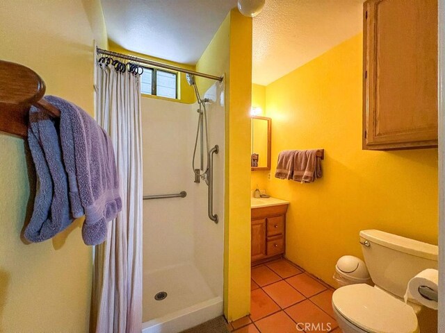 2405 Cedarwood Dr, Pine Mountain Club, CA 93222 - full bath with curtained shower, toilet, tile patterned flooring, vanity, and a textured ceiling