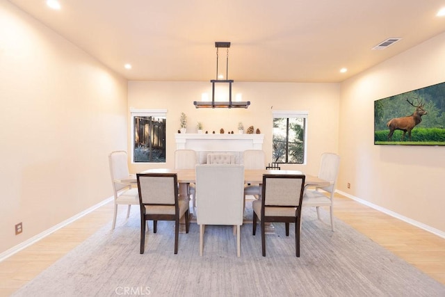 dining area with recessed lighting, baseboards, light wood finished floors, and visible vents