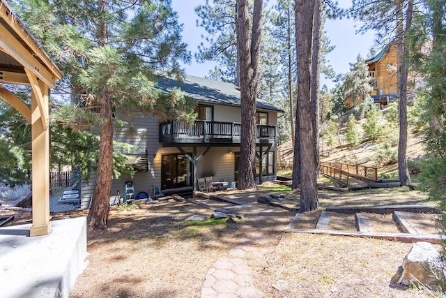 back of property with a patio and a balcony