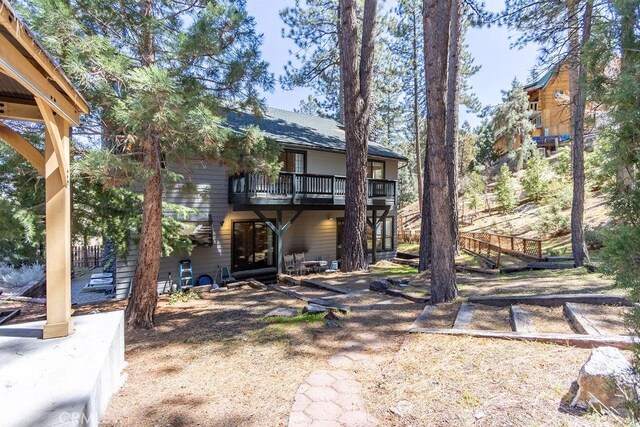 2405 Cedarwood Dr, Pine Mountain Club, CA 93222 - back of property with a patio area and a balcony