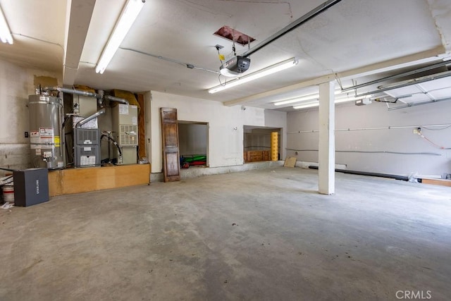 garage featuring a garage door opener and water heater