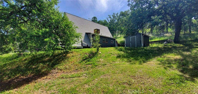 16937 Stagecoach Rd, Corning, CA 96021 - view of yard featuring a storage unit and an outdoor structure