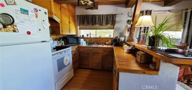 16937 Stagecoach Rd, Corning, CA 96021 - kitchen with wood counters, white appliances, wood finished floors, and a sink