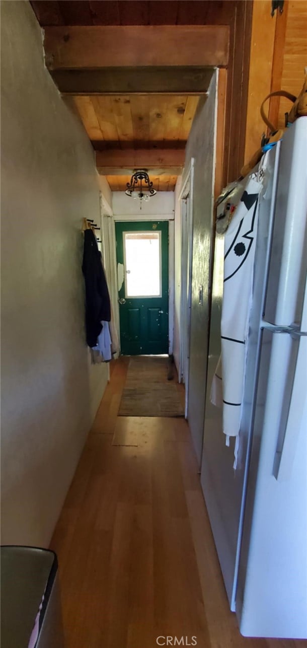 16937 Stagecoach Rd, Corning, CA 96021 - hall featuring beamed ceiling and light wood-style flooring
