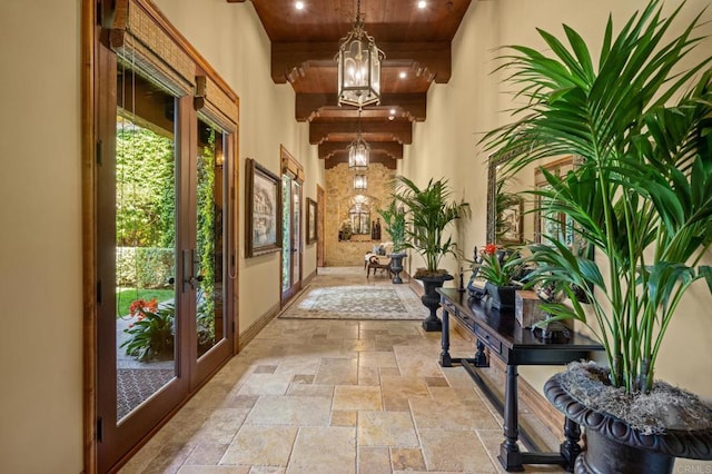 6314 El Apajo, Rancho Santa Fe, CA 92067 - corridor with stone tile flooring, french doors, a chandelier, and wooden ceiling