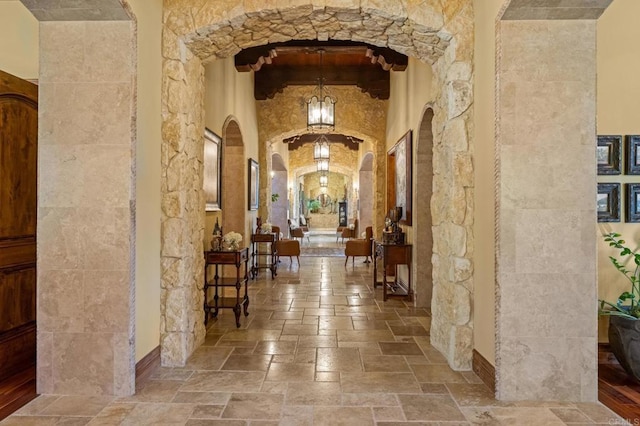 6314 El Apajo, Rancho Santa Fe, CA 92067 - hall featuring stone tile floors and arched walkways