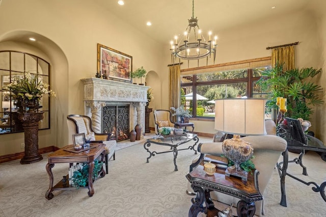 6314 El Apajo, Rancho Santa Fe, CA 92067 - living area featuring carpet flooring, a chandelier, arched walkways, a fireplace, and recessed lighting