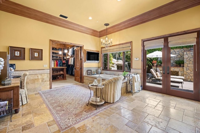 6314 El Apajo, Rancho Santa Fe, CA 92067 - living area with crown molding, stone tile floors, a chandelier, recessed lighting, and french doors