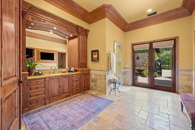 6314 El Apajo, Rancho Santa Fe, CA 92067 - bathroom featuring crown molding, french doors, wainscoting, tile walls, and vanity