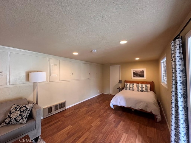 39500 Canyon Dr, Forest Falls, CA 92339 - bedroom featuring recessed lighting, visible vents, a textured ceiling, and wood finished floors