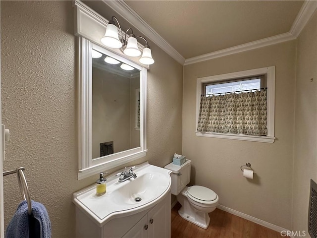 39500 Canyon Dr, Forest Falls, CA 92339 - bathroom featuring vanity, baseboards, crown molding, toilet, and wood finished floors