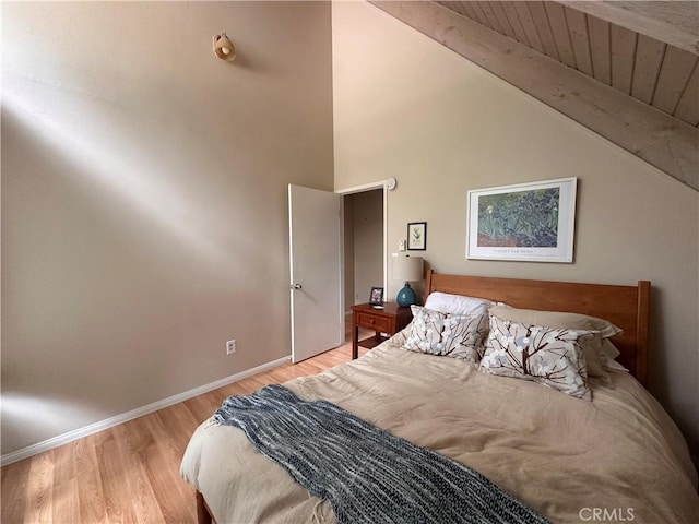 39500 Canyon Dr, Forest Falls, CA 92339 - bedroom featuring baseboards, wood finished floors, and lofted ceiling with beams