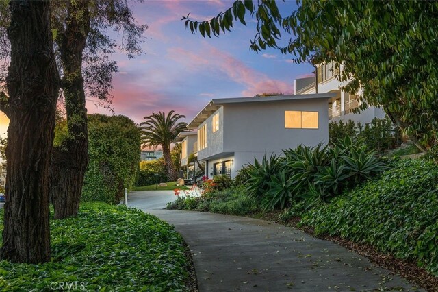 2516 Bayside Dr, Corona Del Mar, CA 92625 - property exterior at dusk with stucco siding