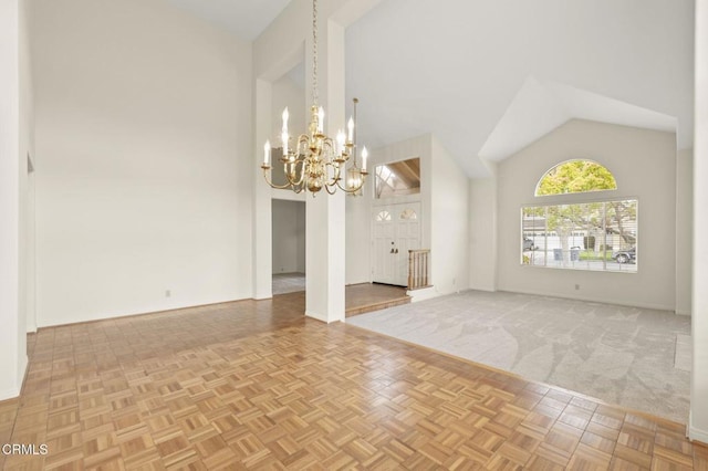 2101 Fox Den Ct, Oxnard, CA 93036 - unfurnished dining area featuring baseboards, high vaulted ceiling, and a notable chandelier