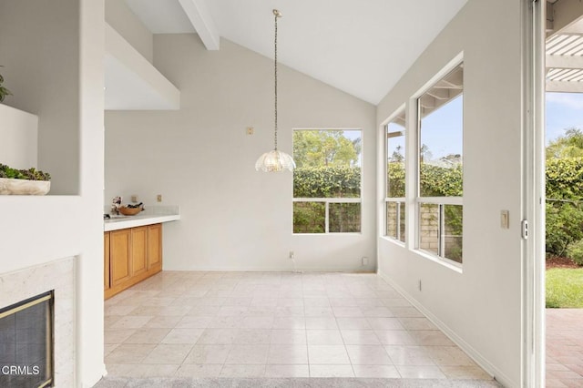 2101 Fox Den Ct, Oxnard, CA 93036 - unfurnished dining area with beam ceiling, baseboards, high vaulted ceiling, a fireplace, and light tile patterned floors