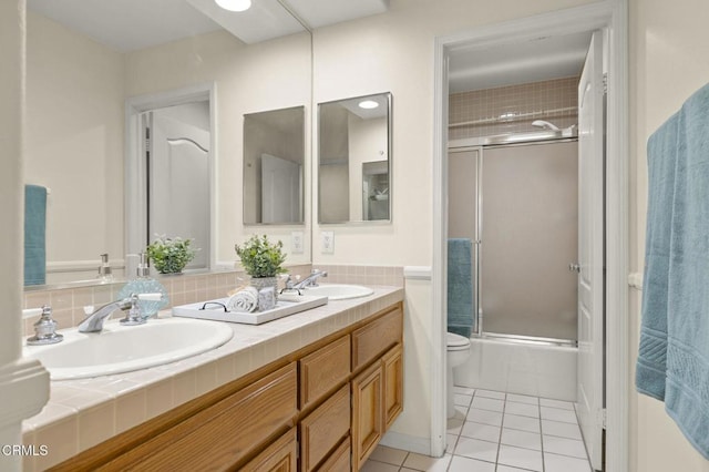 2101 Fox Den Ct, Oxnard, CA 93036 - full bathroom with tile patterned floors, shower / bath combination with glass door, a sink, and toilet
