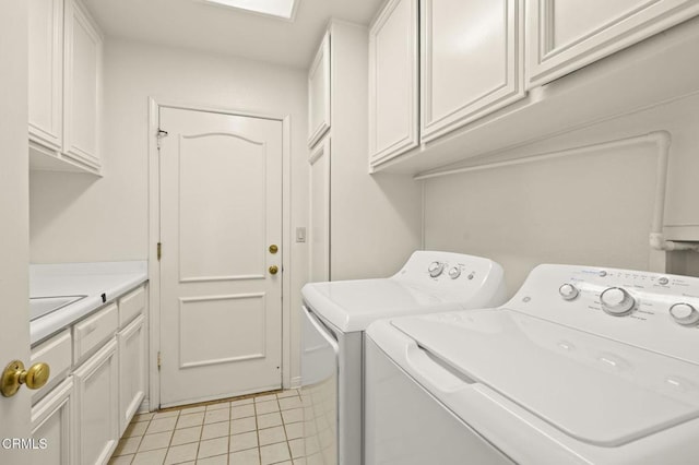2101 Fox Den Ct, Oxnard, CA 93036 - clothes washing area with light tile patterned flooring, cabinet space, and washing machine and dryer
