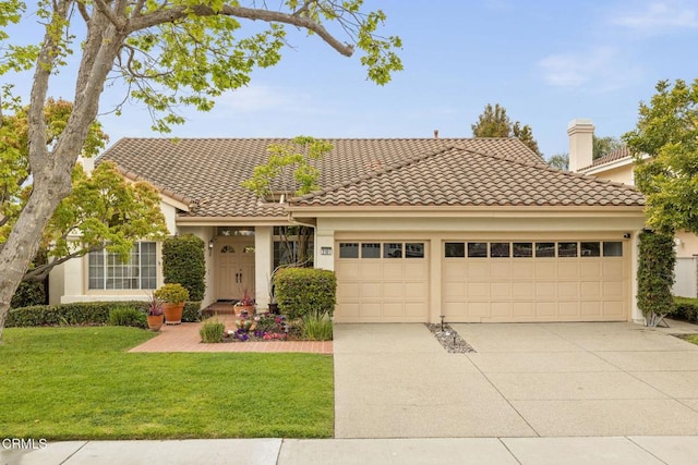 2101 Fox Den Ct, Oxnard, CA 93036 - view of front of property featuring a front yard, a garage, concrete driveway, a tile roof, and stucco siding