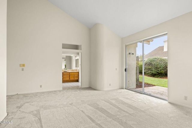 2101 Fox Den Ct, Oxnard, CA 93036 - interior space featuring light carpet, high vaulted ceiling, access to exterior, and baseboards